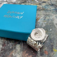 Load image into Gallery viewer, Spiral shell silver textured adjustable ring