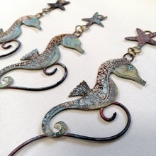 Load image into Gallery viewer, brass seahorse with starfish wall hanging handmade by Sharon McSwiney