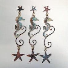 Load image into Gallery viewer, brass seahorse with starfish wall hanging handmade by Sharon McSwiney
