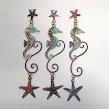Load image into Gallery viewer, brass seahorse with starfish wall hanging handmade by Sharon McSwiney