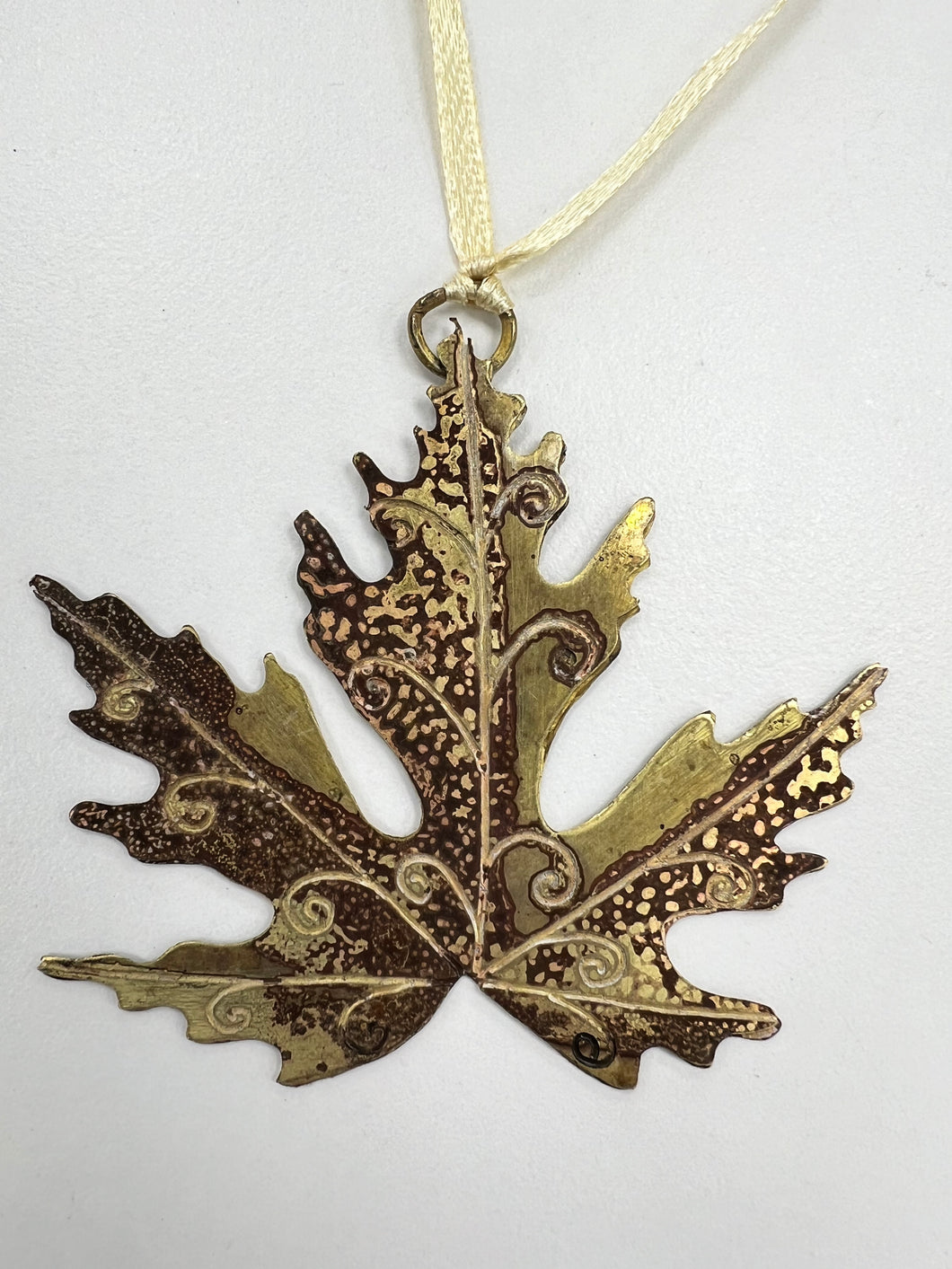 Large acer leaf decoration in brass
