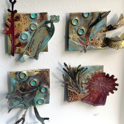 Metal seaweed & sea creatures in copper & brass framed as a picture handmade by Sharon McSwiney