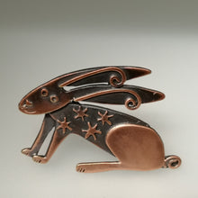 Load image into Gallery viewer, Copper coloured hare brooch with stars on its body handmade by Sharon McSwiney
