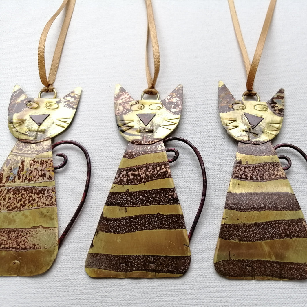 Striped brass cat decorations handmade by Sharon McSwiney