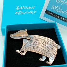 Load image into Gallery viewer, badger brooch in a copper finish handmade by Sharon McSwiney  in a gift box
