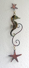 Load image into Gallery viewer, brass seahorse with starfish wall hanging handmade by Sharon McSwiney
