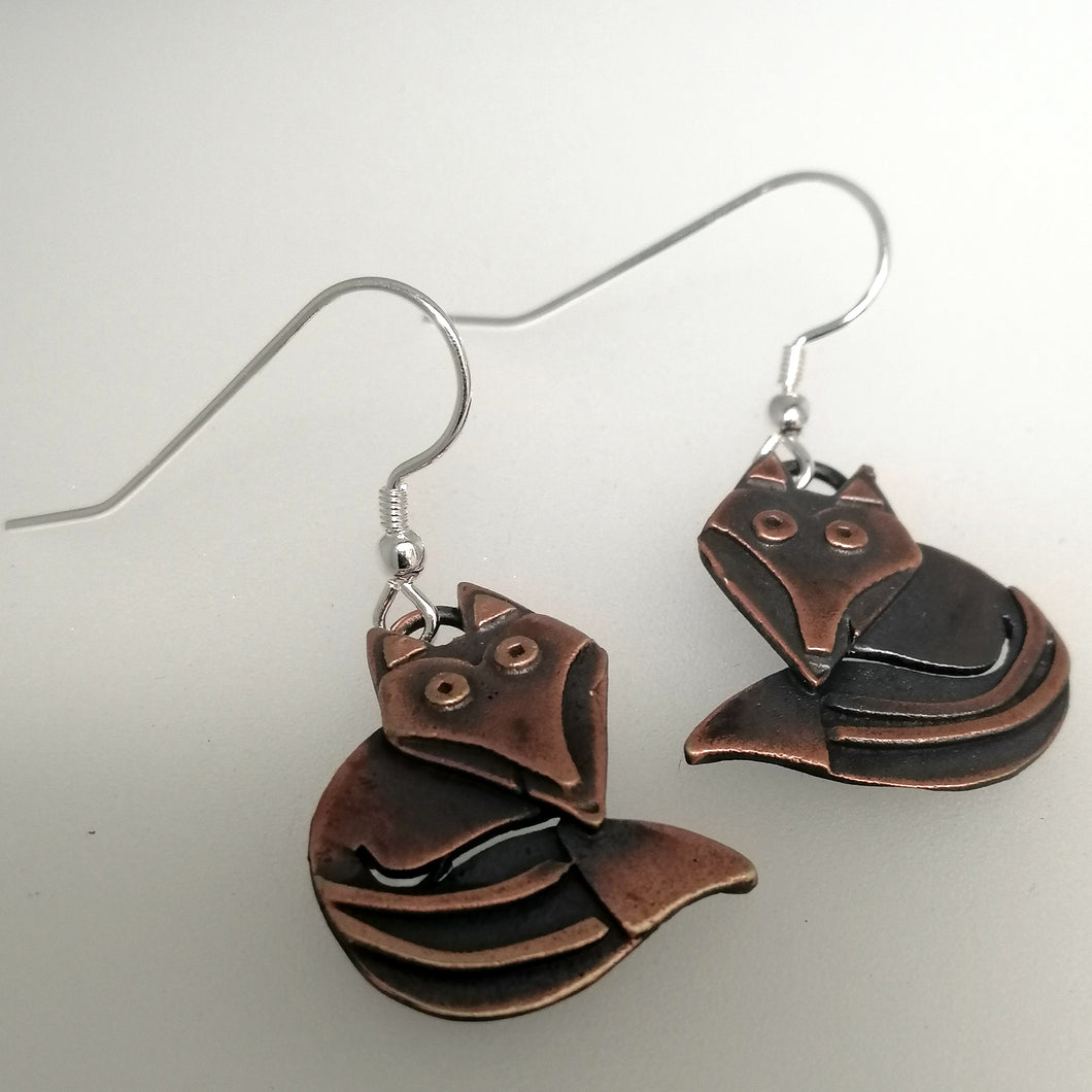 Fox earrings in a copper finish with silver hooks handmade by Sharon McSwiney