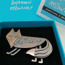 Load image into Gallery viewer, Fox brooch with stars on its body in a copper finish handmade by Sharon McSwiney in a gift box
