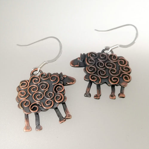 swirly sheep drop earrings in a copper finish handmade by Sharon McSwiney